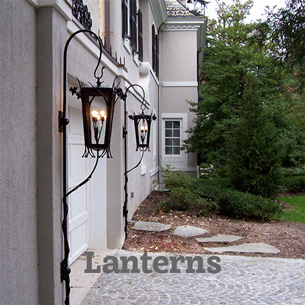 Unusual landscape lanterns light the driveway