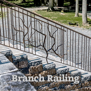 Stair and ramp railings with forged branches