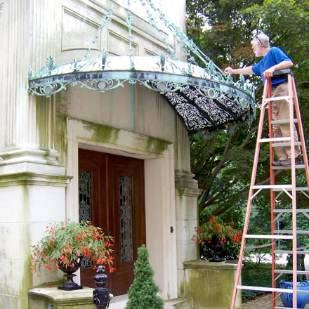 Inspecting the historic canopy before repair and restoration.
